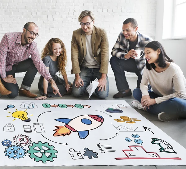 Designers working with poster and start up — Stock Photo, Image
