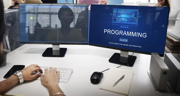 Businessman working on computer with programming — Stock Photo, Image