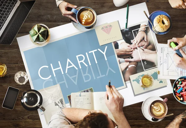 Mesa com cartaz com caridade — Fotografia de Stock