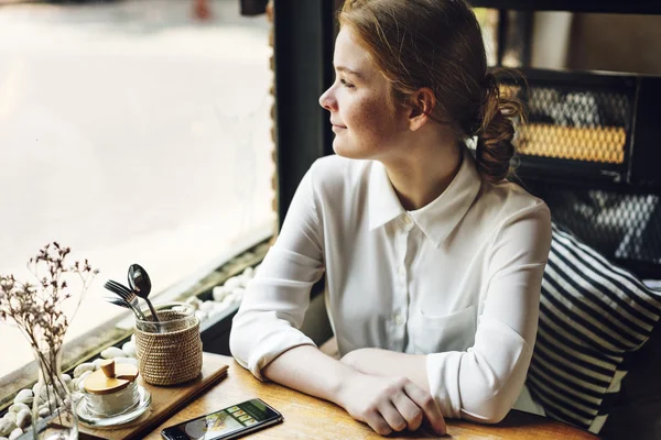 Girl spending time in cafe — Stock Photo, Image