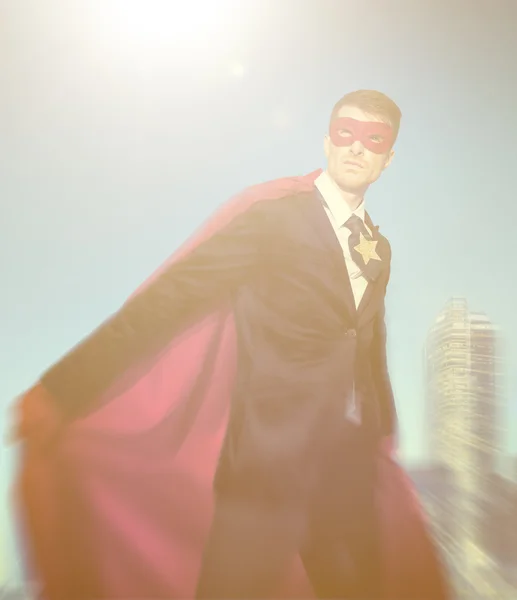 Superhero Businessman in modern city — Stockfoto