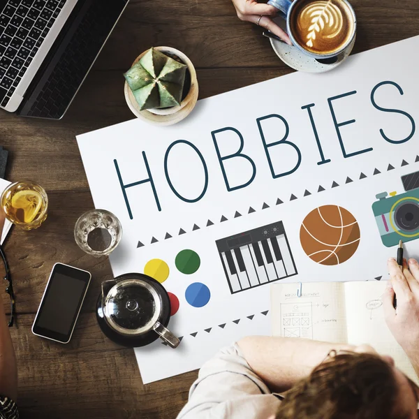 Table with poster with Hobbies — Stock Photo, Image