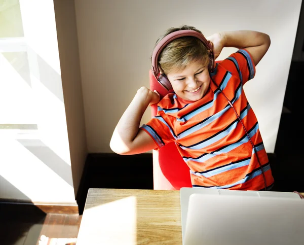 Boy playing with computer — Stock Photo, Image