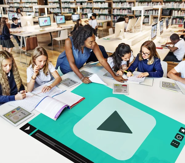 Teacher with pupils at school — Stock Photo, Image