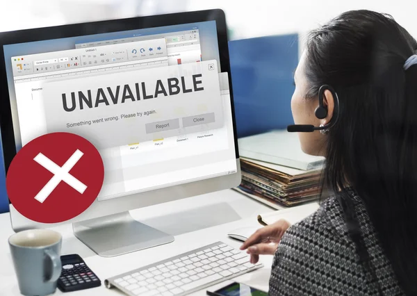 Businesswoman working on computer with unavailable — Stock Photo, Image