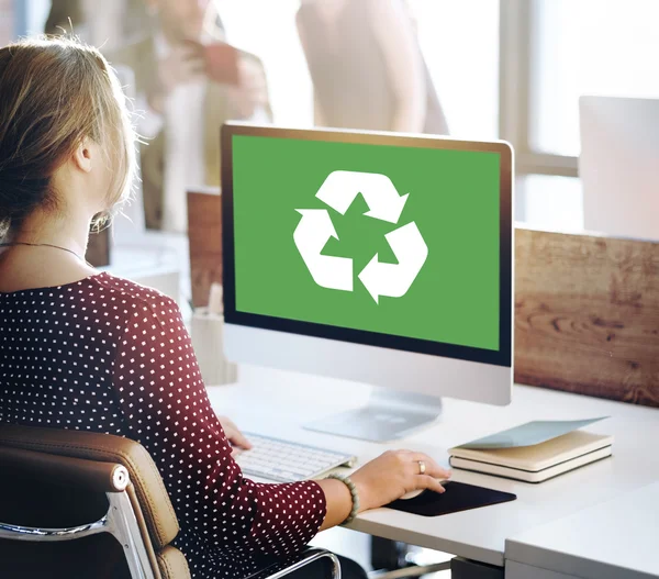 Businesswoman working on computer with environmental conservation — Stock Photo, Image