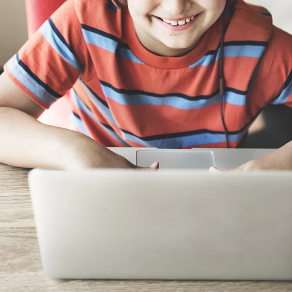 Boy playing with computer — Stock Photo, Image