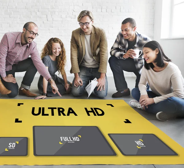 Diseñadores trabajando con cartel y ultra hd — Foto de Stock