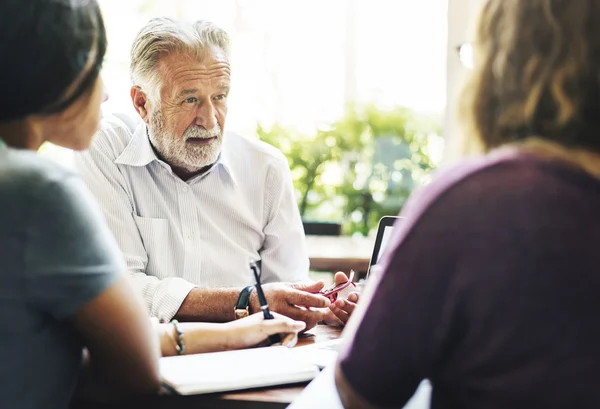 Professor with students at meeting Stock Picture