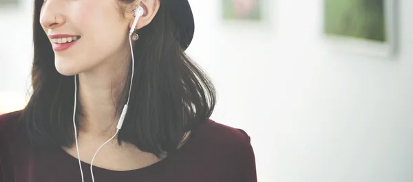 Girl in Earphones listening music — Stock Photo, Image