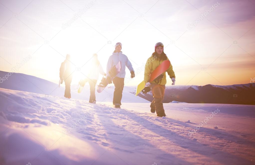 Snowboarders on top of mountain