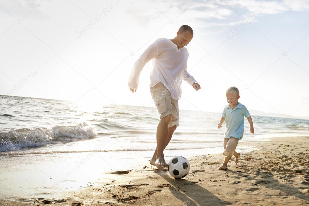father and son playing with ball