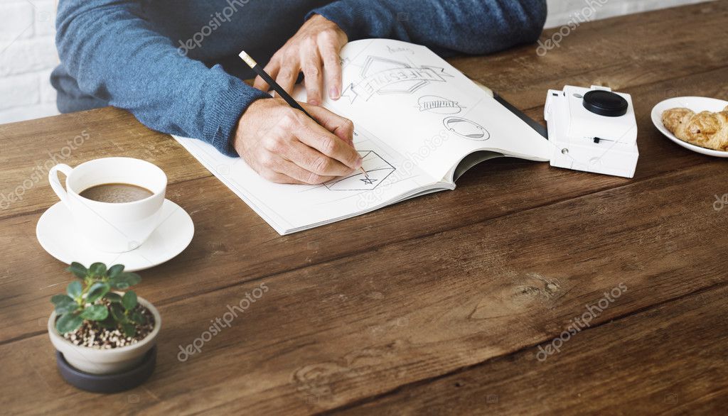 Man Drawing Sketch in notebook, Artwork Concept