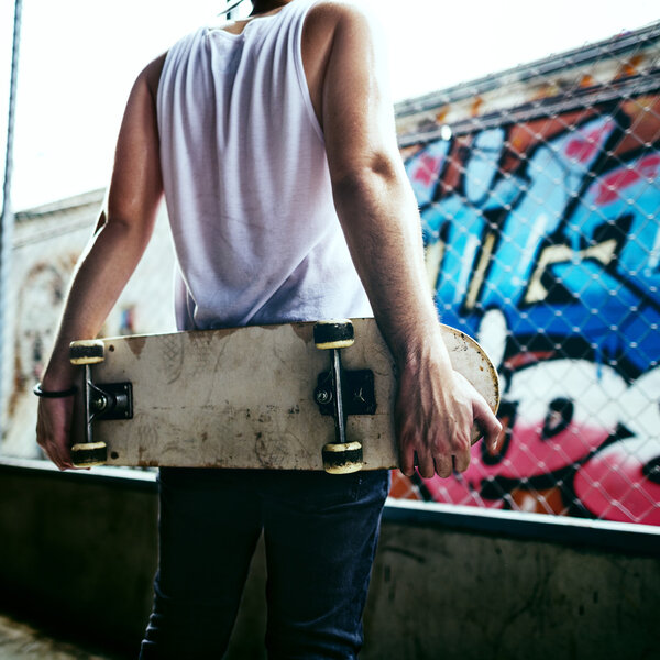 Man holding skateboard