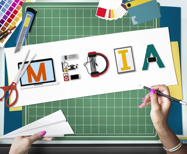 Woman holding pencil, media text — Stock Photo, Image