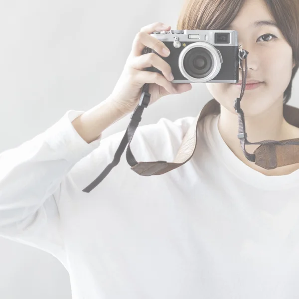 Beautiful Asian girl with camera — Stock Photo, Image