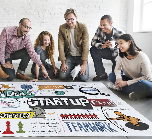 Designers working with poster and startup — Stock Photo, Image