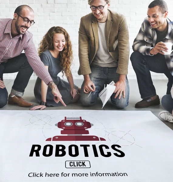Designers working with poster and robotics — Stock Photo, Image