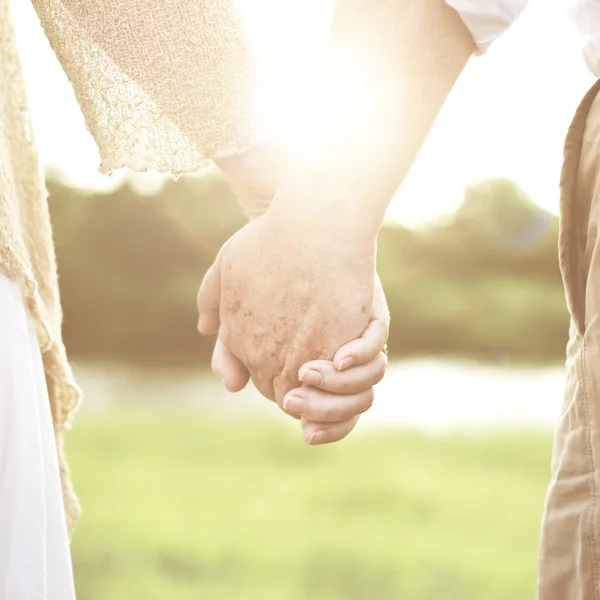 Seniors couple hands — Stock Photo, Image