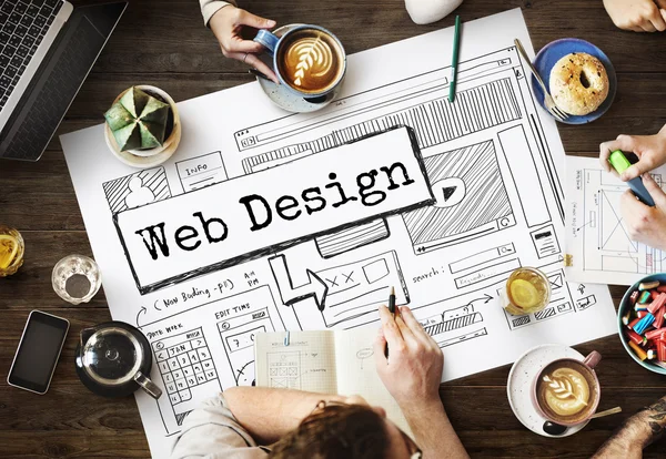 Mesa con póster con diseño web — Foto de Stock