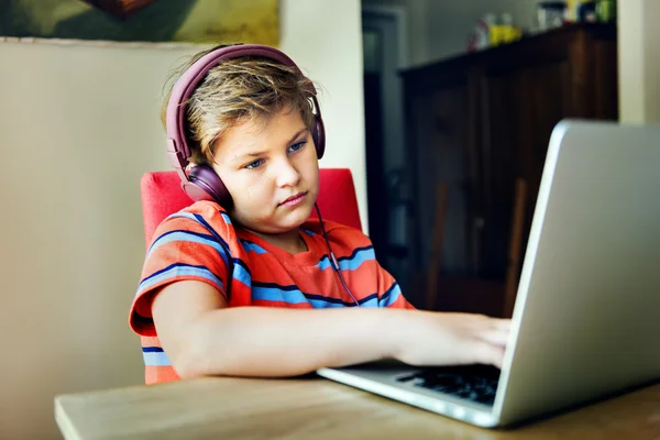 Boy playing with computer — Stock Photo, Image