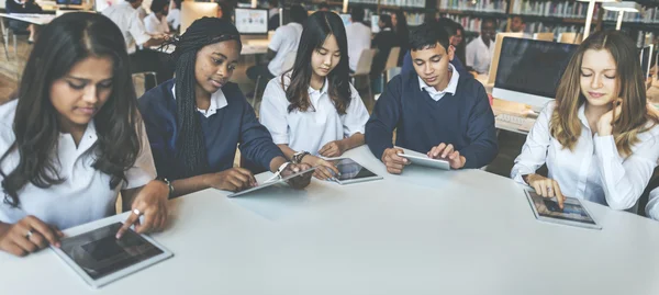 Students browsing digital tablets — Stock Photo, Image