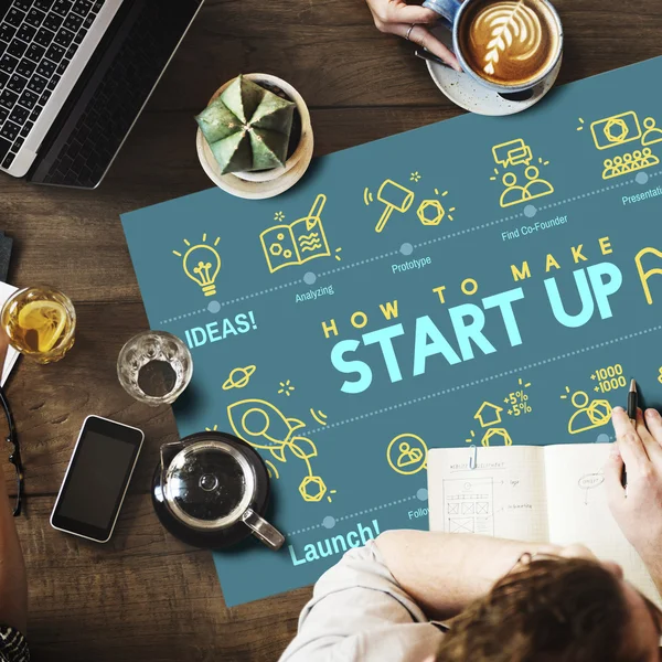 Mesa con póster con Start Up —  Fotos de Stock