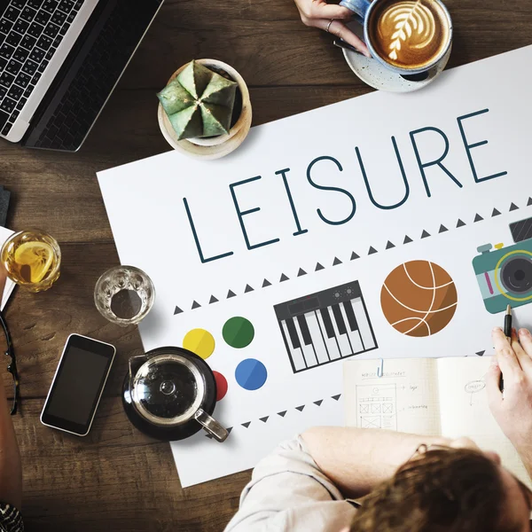 Table with poster with Leisure — Stock Photo, Image