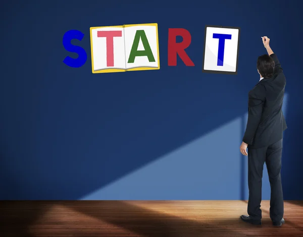 Businessman stands near wall — Stock Photo, Image