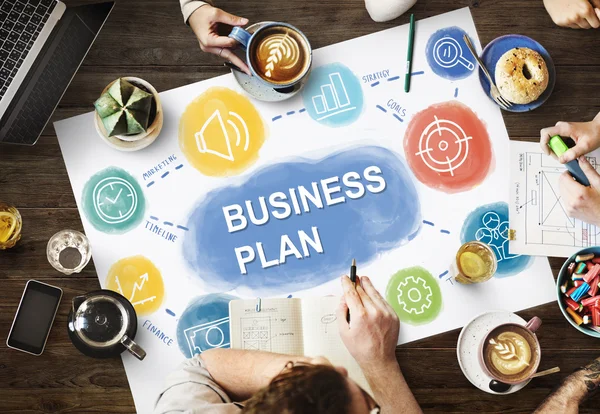 Table with poster with Business Plan — Stock Photo, Image