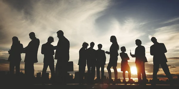 Business People silhouettes on sunset — Stock Photo, Image