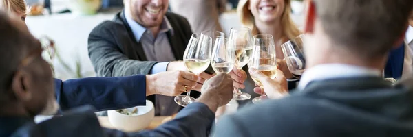 Business People cheers with glasses