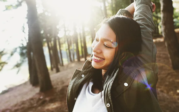 Beautiful woman in sunny forest — Stock Photo, Image