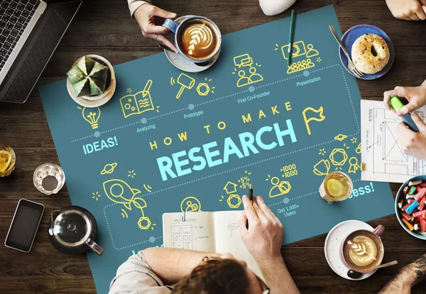 Table with poster with Research — Stock Photo, Image