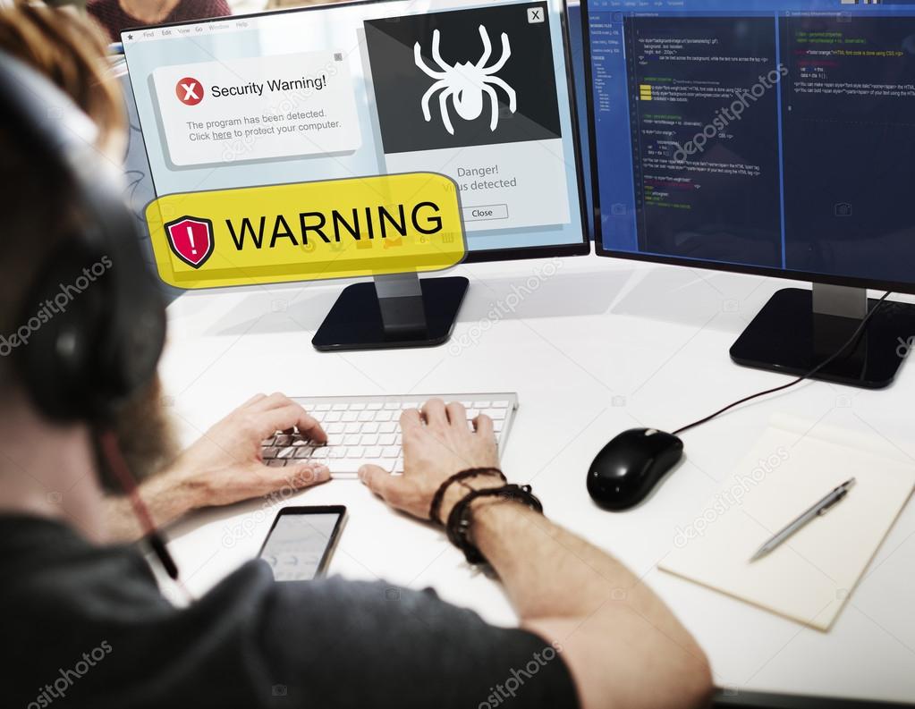 businessman working on computer with Warning