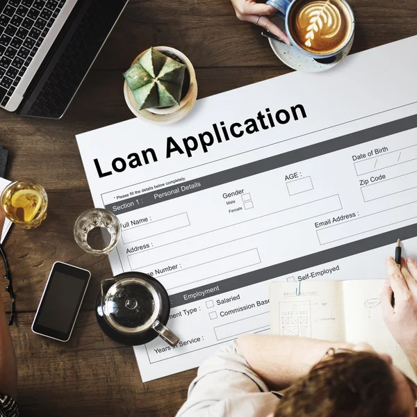 Table with poster with Loan Application — Stock Photo, Image