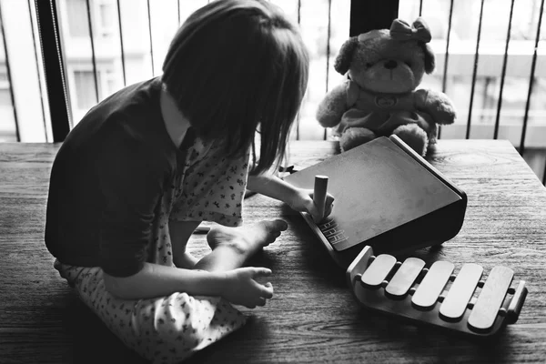 Kid Playing and drawing on blackboard — Stock Photo, Image