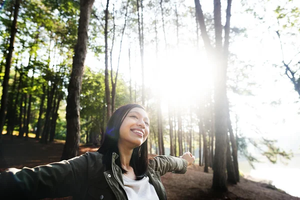 Beautiful woman in sunny forest — Stock Photo, Image