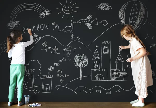 Girls drawing on Blackboard — Stock Photo, Image