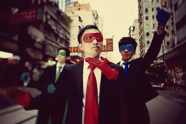 Businessmen in superhero masks — Stock Photo, Image