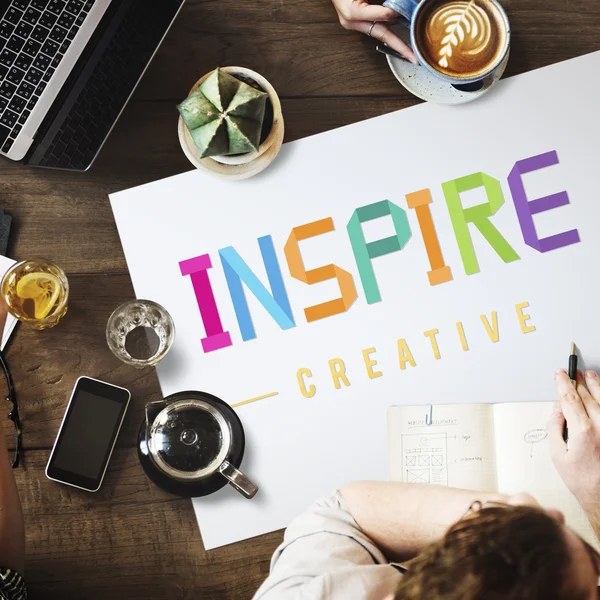 Tabel met poster met inspire — Stockfoto