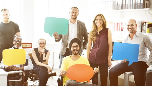 Business Team Holding Speech Bubble Signs — Stock Photo, Image