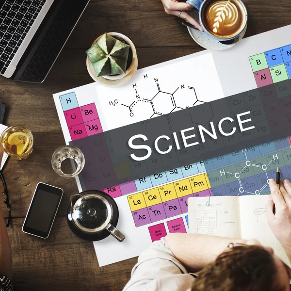 Mesa con póster con ciencia — Foto de Stock