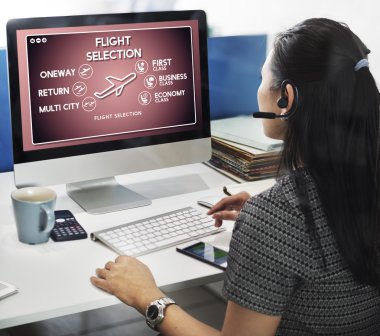 businesswoman working on computer with Flight Selection clipart