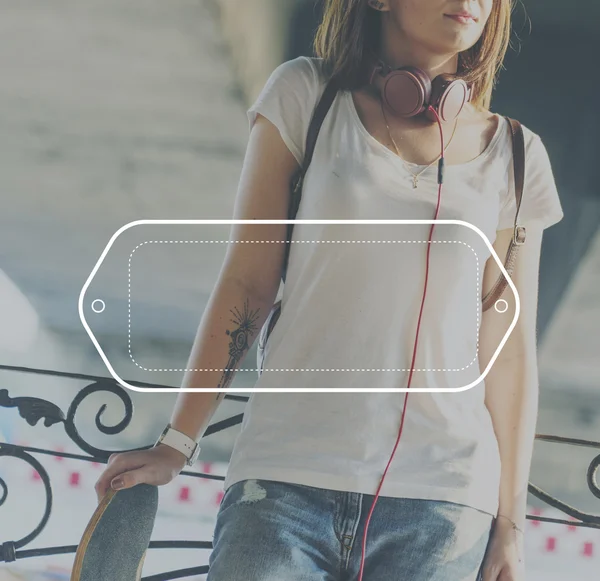 Young woman with skateboard on background — Stock Photo, Image