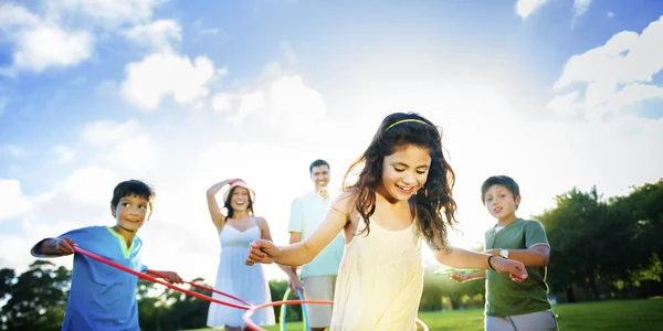 Family doing exercise with hula hoops — Stock Photo, Image