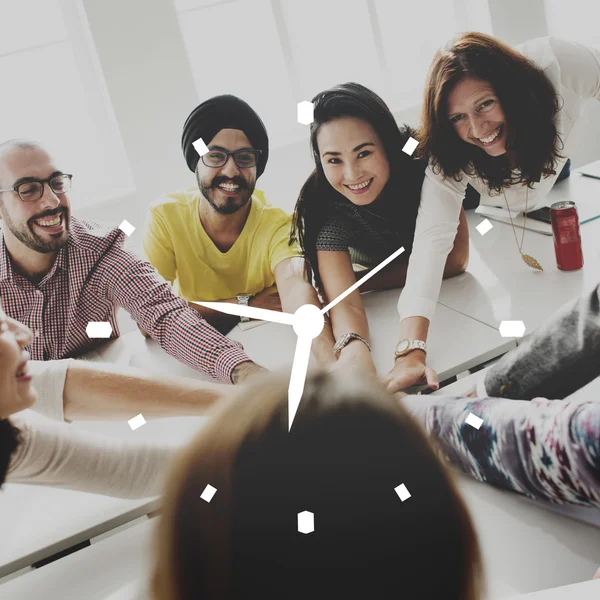 People with hands together and clock — Stock Photo, Image