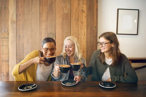 Beautiful girls drinking coffee — Stock Photo, Image