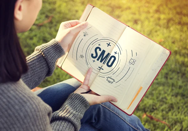 Woman holding diary in hands — Stock Photo, Image