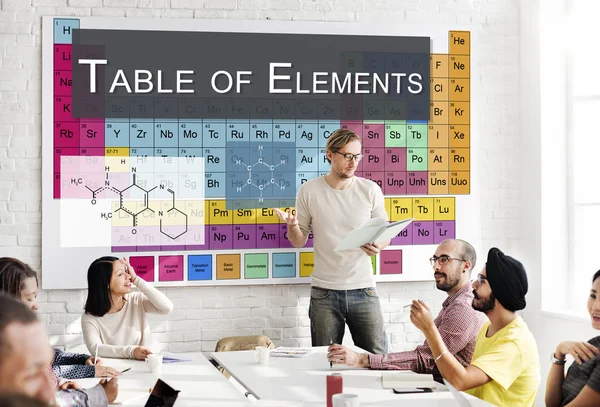 Деловая встреча с Table Of Elements — стоковое фото